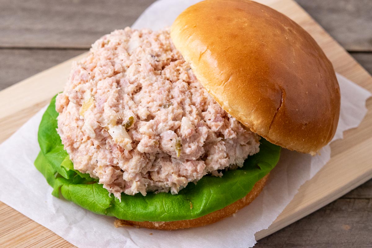 ham spread piled on a sandwich bun.