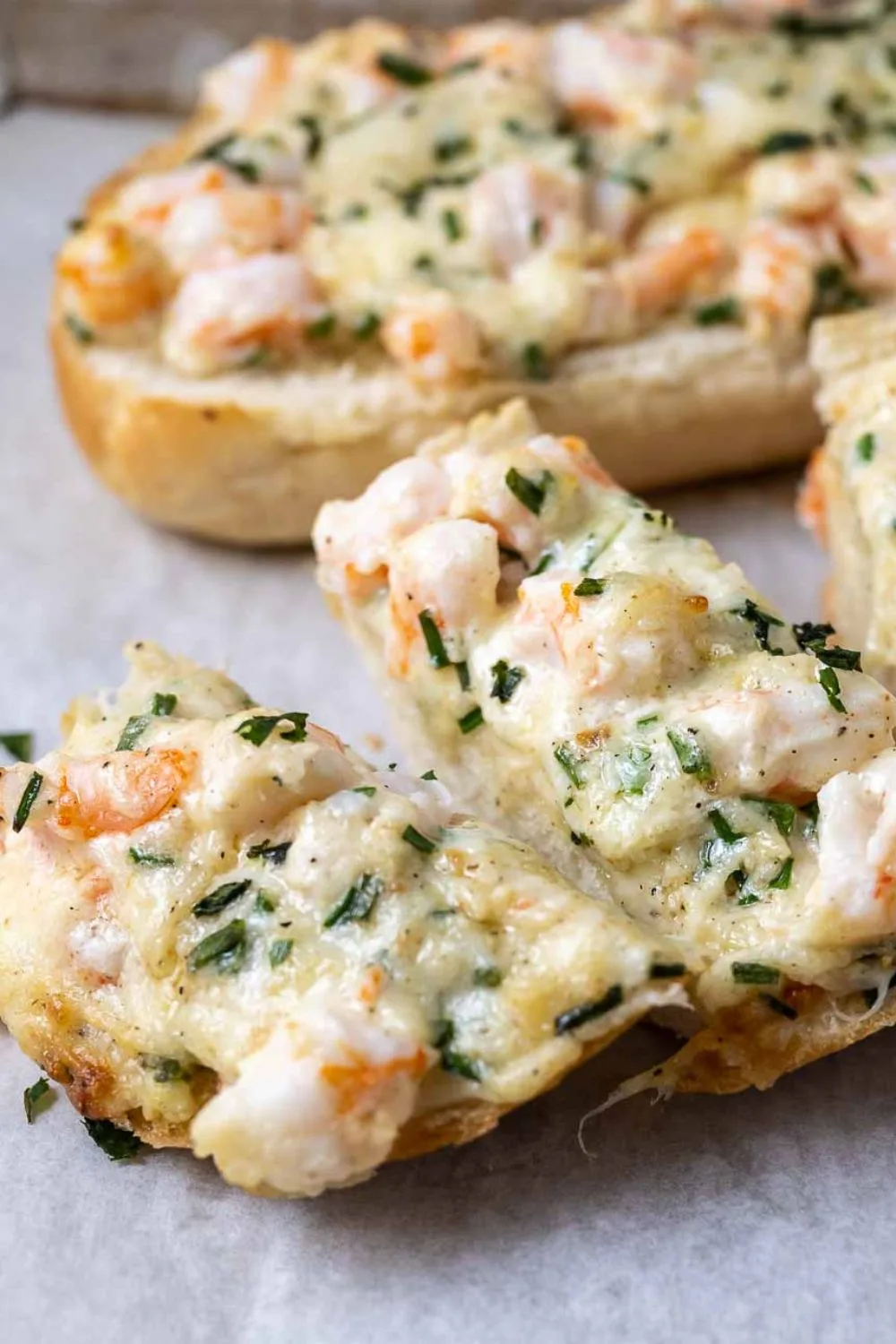 Shrimp Garlic Bread on parchment paper.