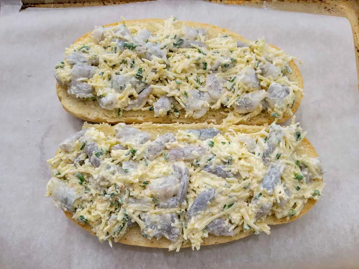cheese and shrimp mixture spread on Italian loaf halves.