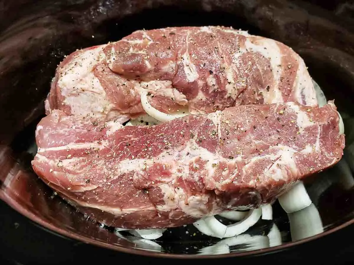 Country Style Ribs in the Slow Cooker, over onions.