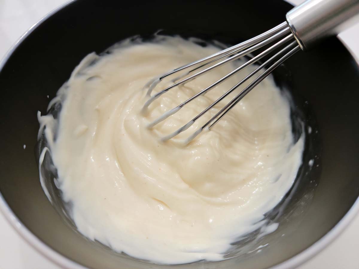 mayo and vinegar whisked in a bowl.