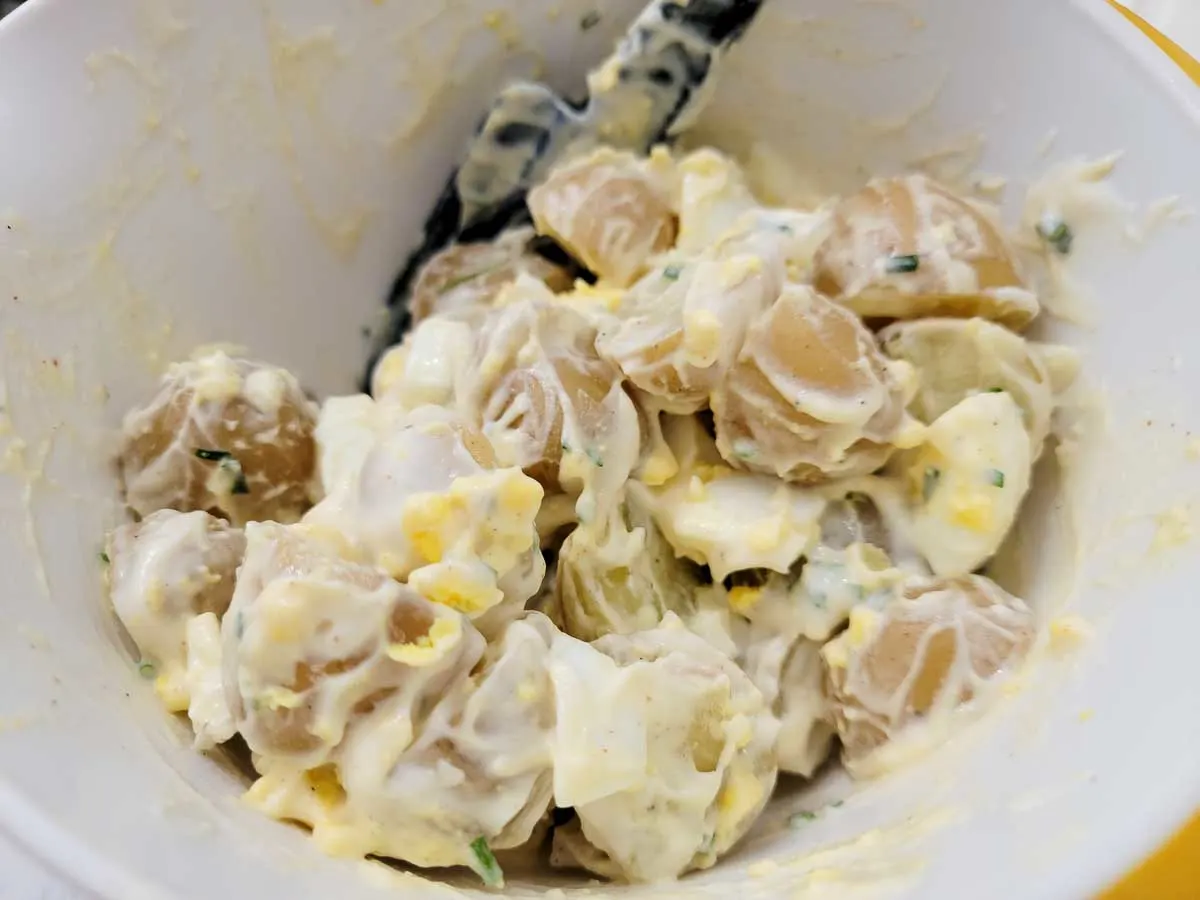 Baby Potato Salad mixed together in a bowl.