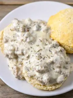 Old Fashioned Biscuits and Gravy on a plate.