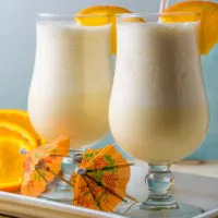 Orange Juice Slush in two tall glasses.