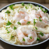 Shrimp Alfredo with Angel Hair Pasta in a bowl.