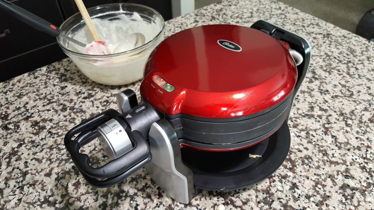 a double sided waffle iron on a counter toop.