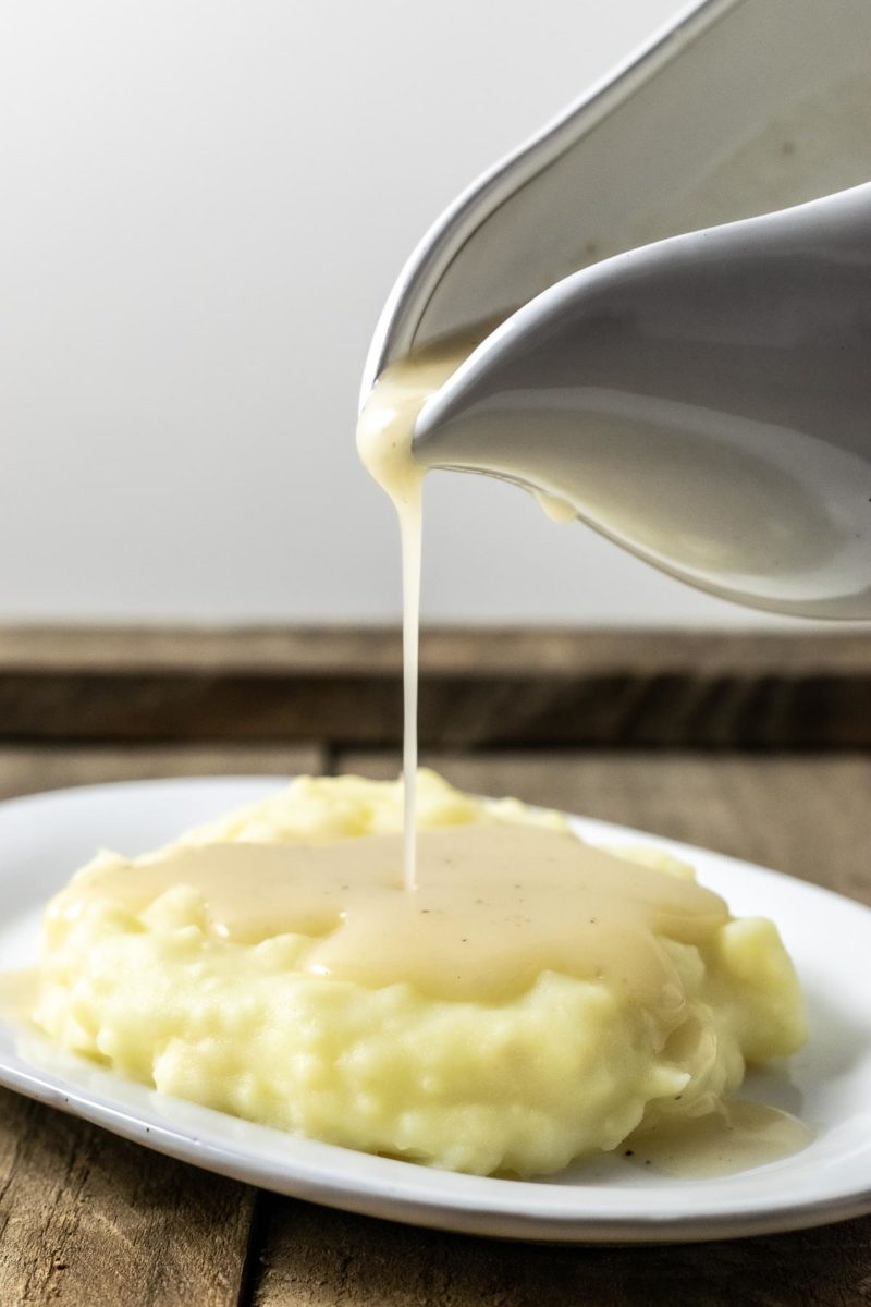 3 Ingredient Gravy being poured over mashed potatoes.