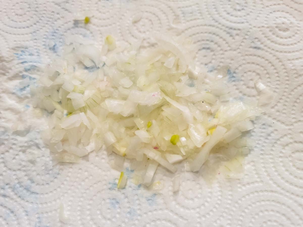 diced onions on paper towel.