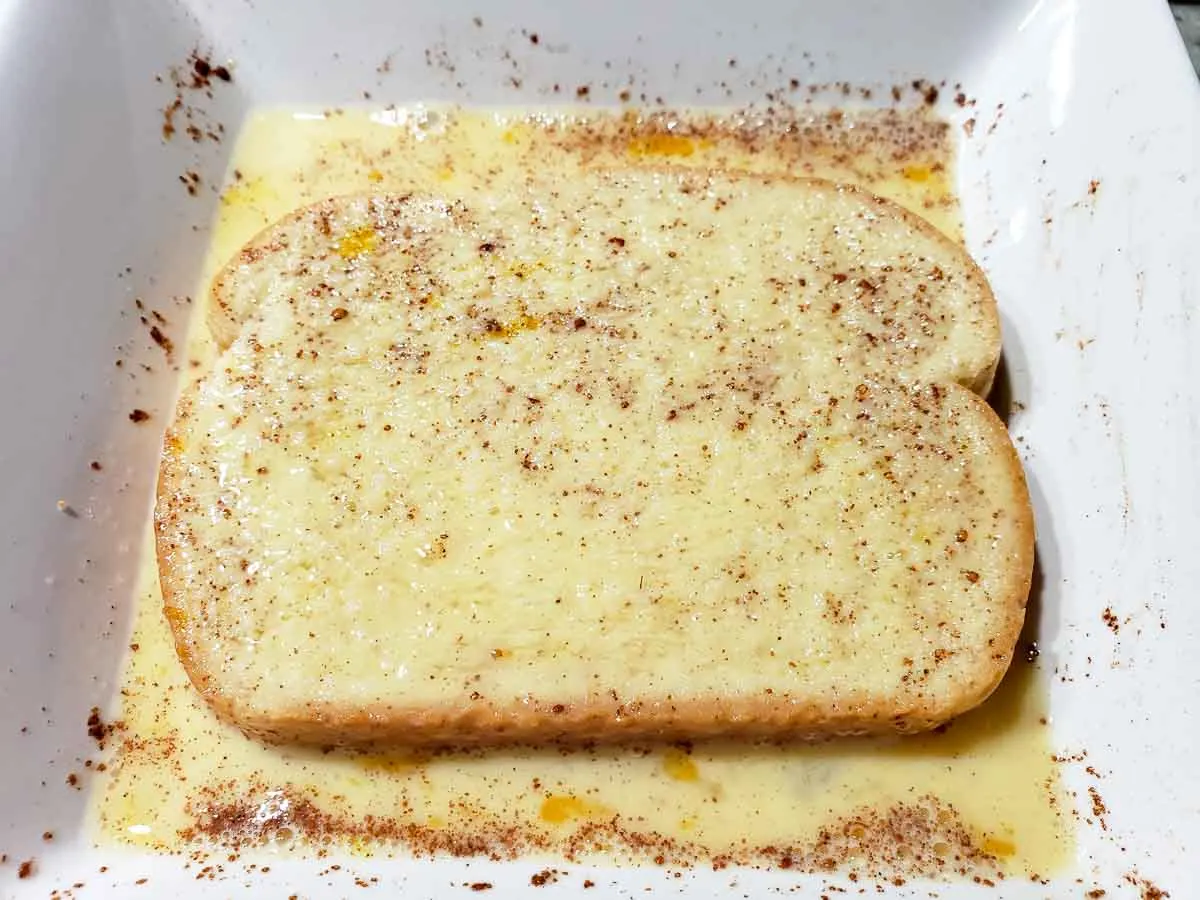 a bread slice in the egg mixture.