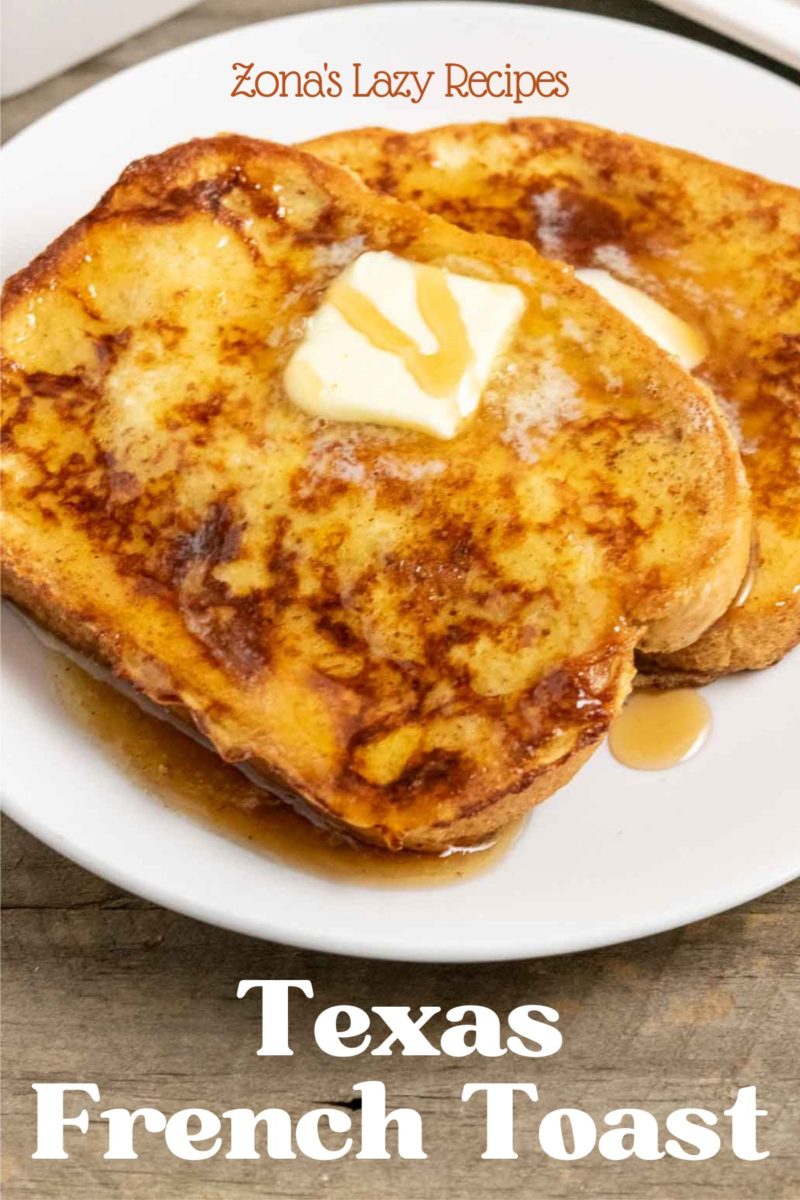 French Texas Toast slices on a plate topped with butter and syrup.