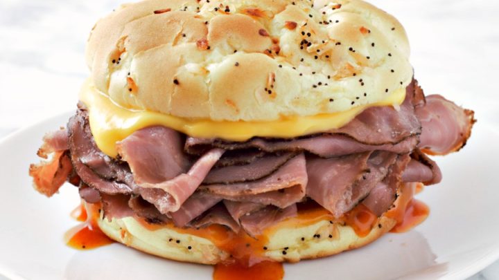 Beef and Cheddar Recipe photo with a sandwich on a plate.