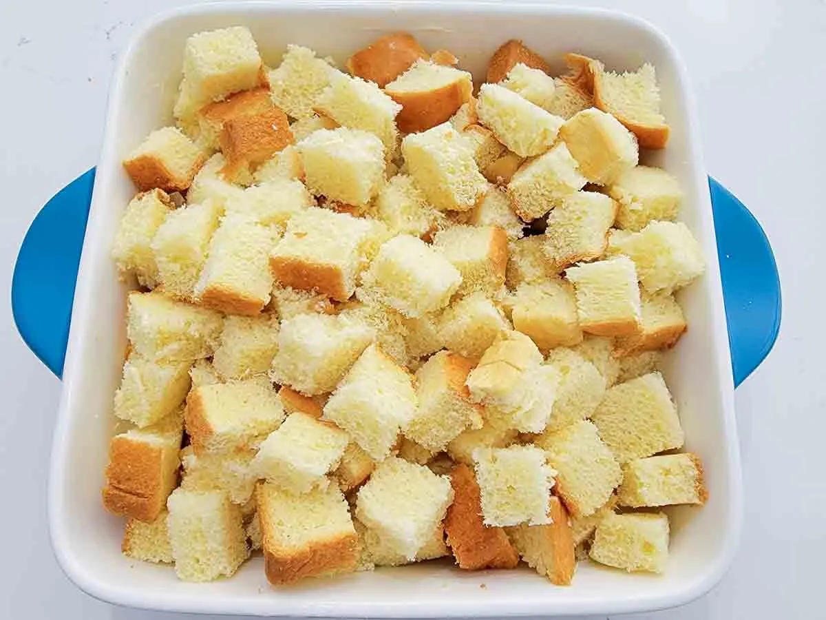 bread cubes in a baking dish.