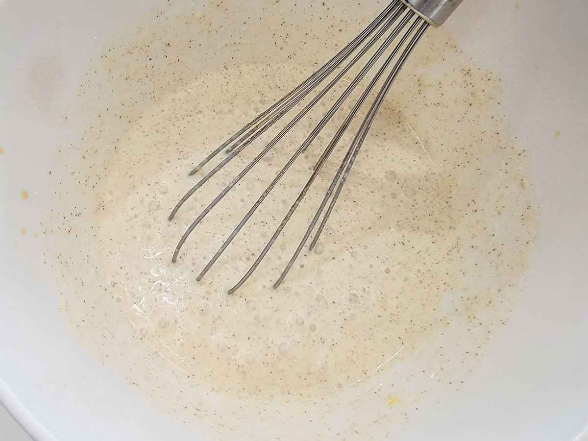 french toast batter whisked in a bowl.