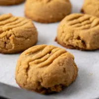 Soft and Chewy Peanut Butter Cookies on a baking sheet.