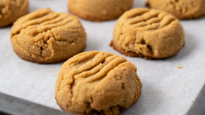 Soft and Chewy Peanut Butter Cookies on a baking sheet.