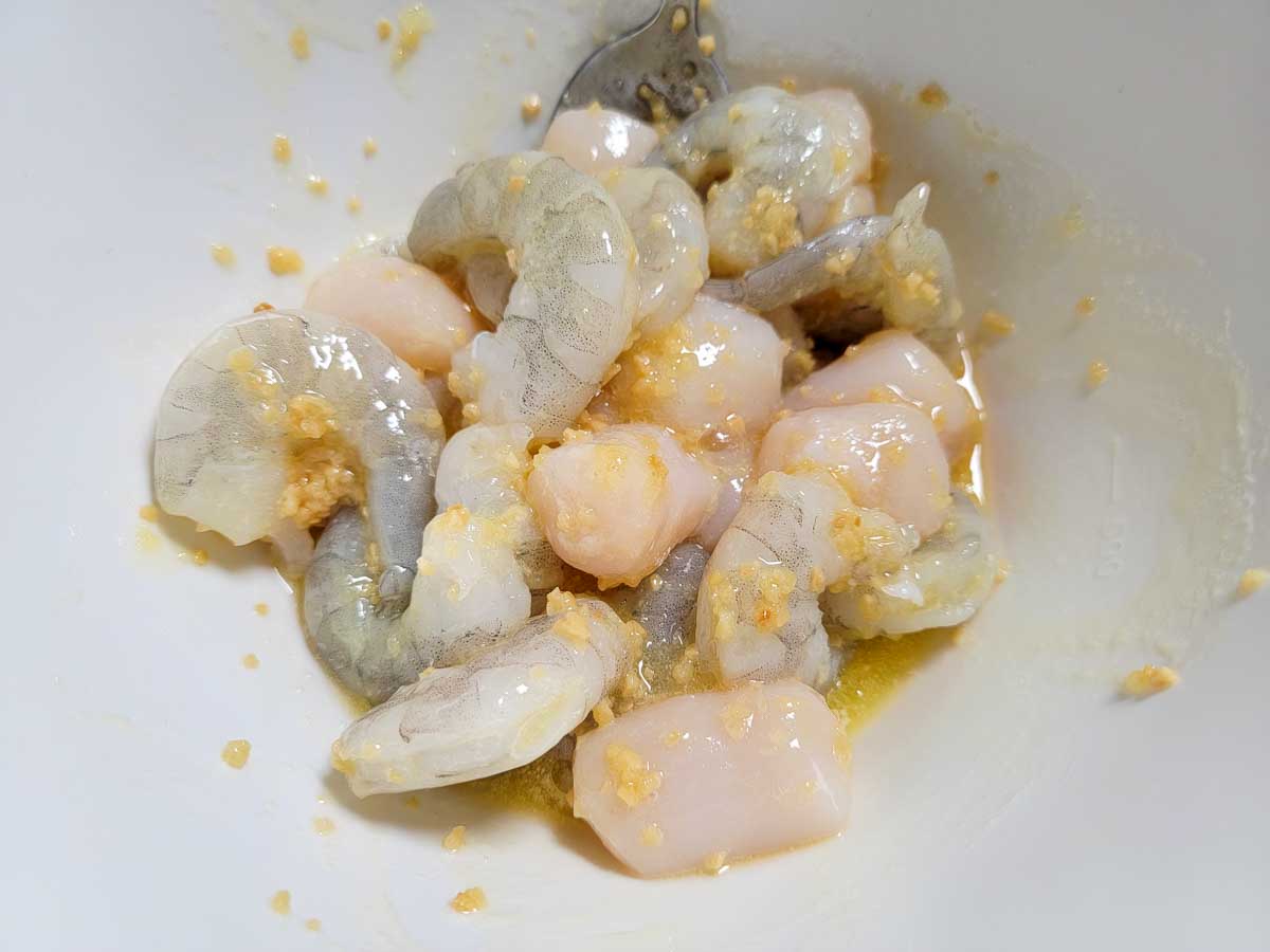 scallops and shrimp tossed in the melted butter mixture.