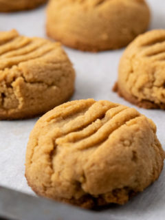 Soft and Chewy Peanut Butter Cookies on a baking sheet.