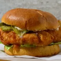 Crispy Buttermilk Chicken Sandwich on parchment paper.