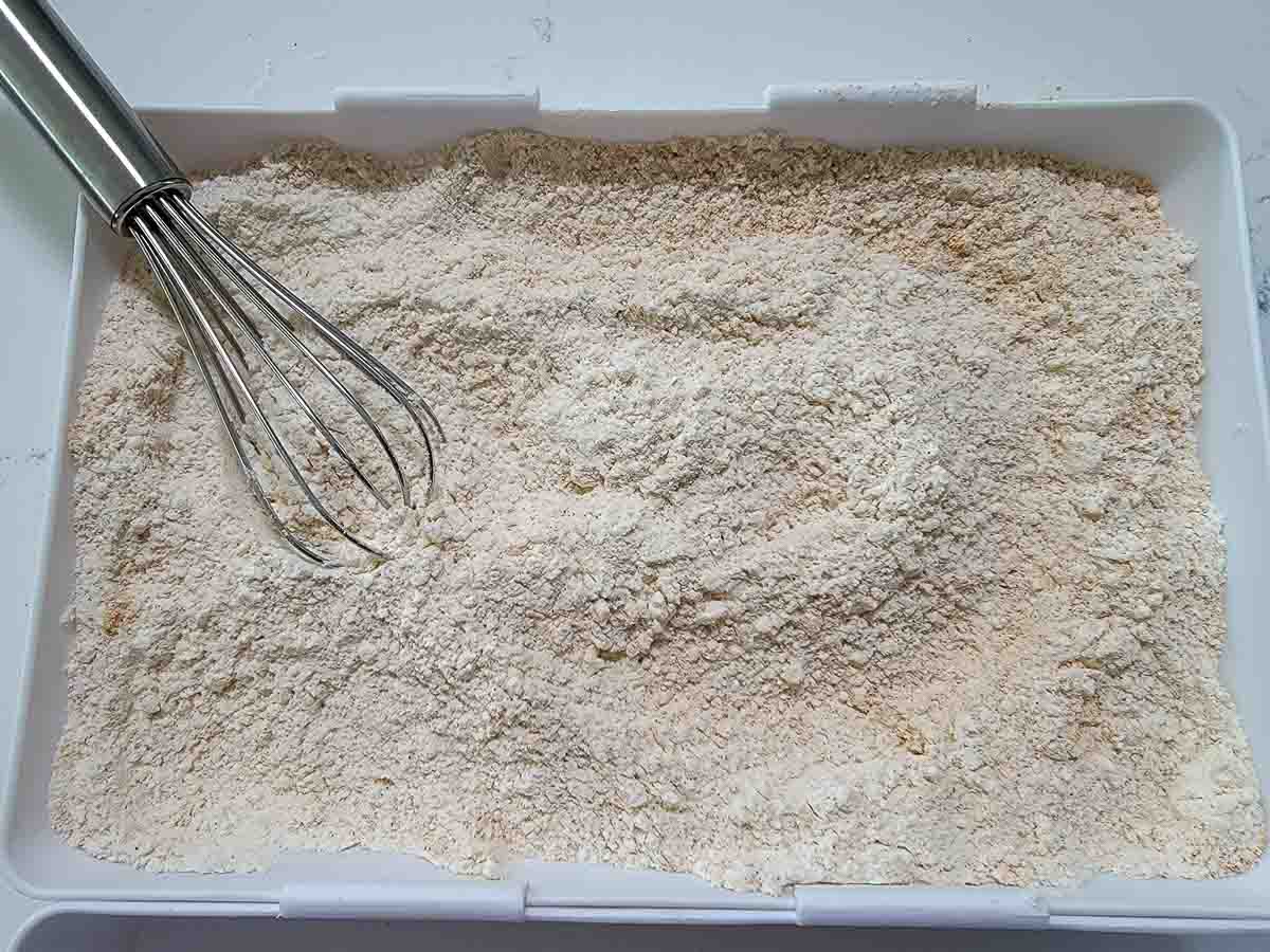 flour, baking powder, and taco seasoning in a coating tray.