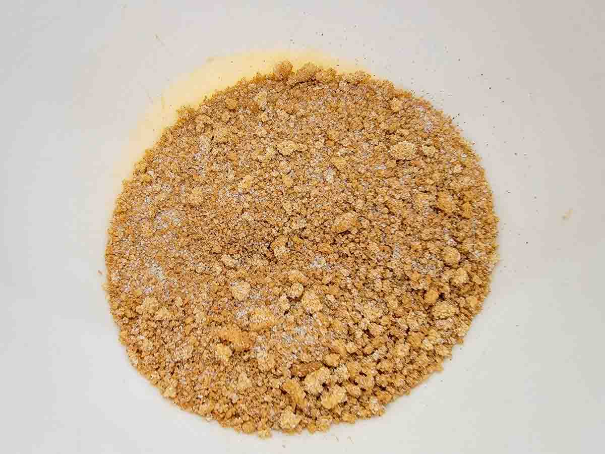 white sugar, brown sugar, salt, and pumpkin pie spice mixed in a bowl.
