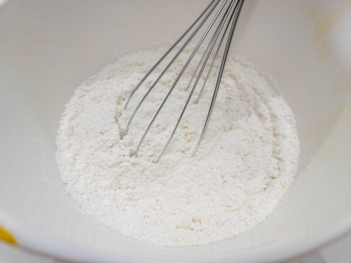 flour, cream of tartar, baking soda, and salt whisked in a bowl.