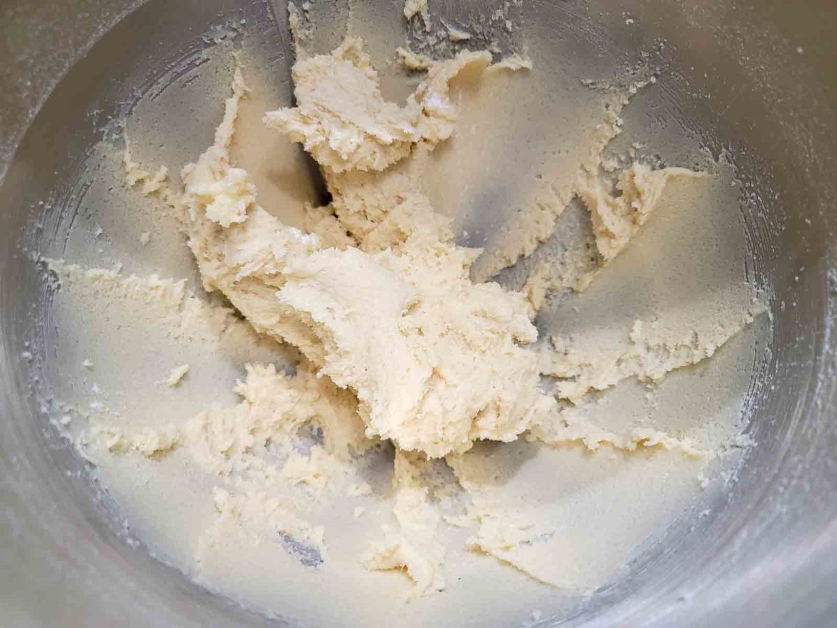 flour mixture mixed into butter mixture in a bowl.