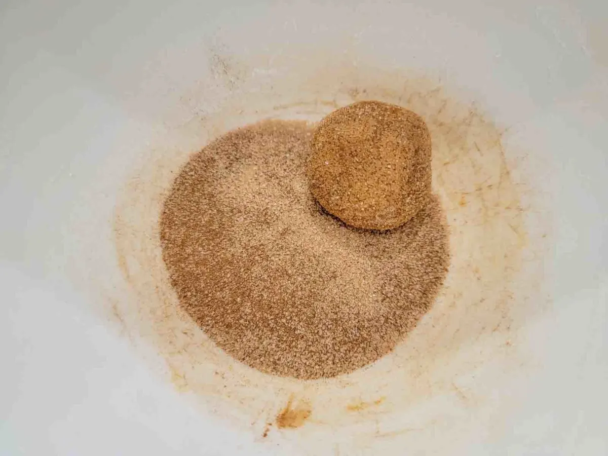 cookie dough ball in the cinnamon sugar mixture.