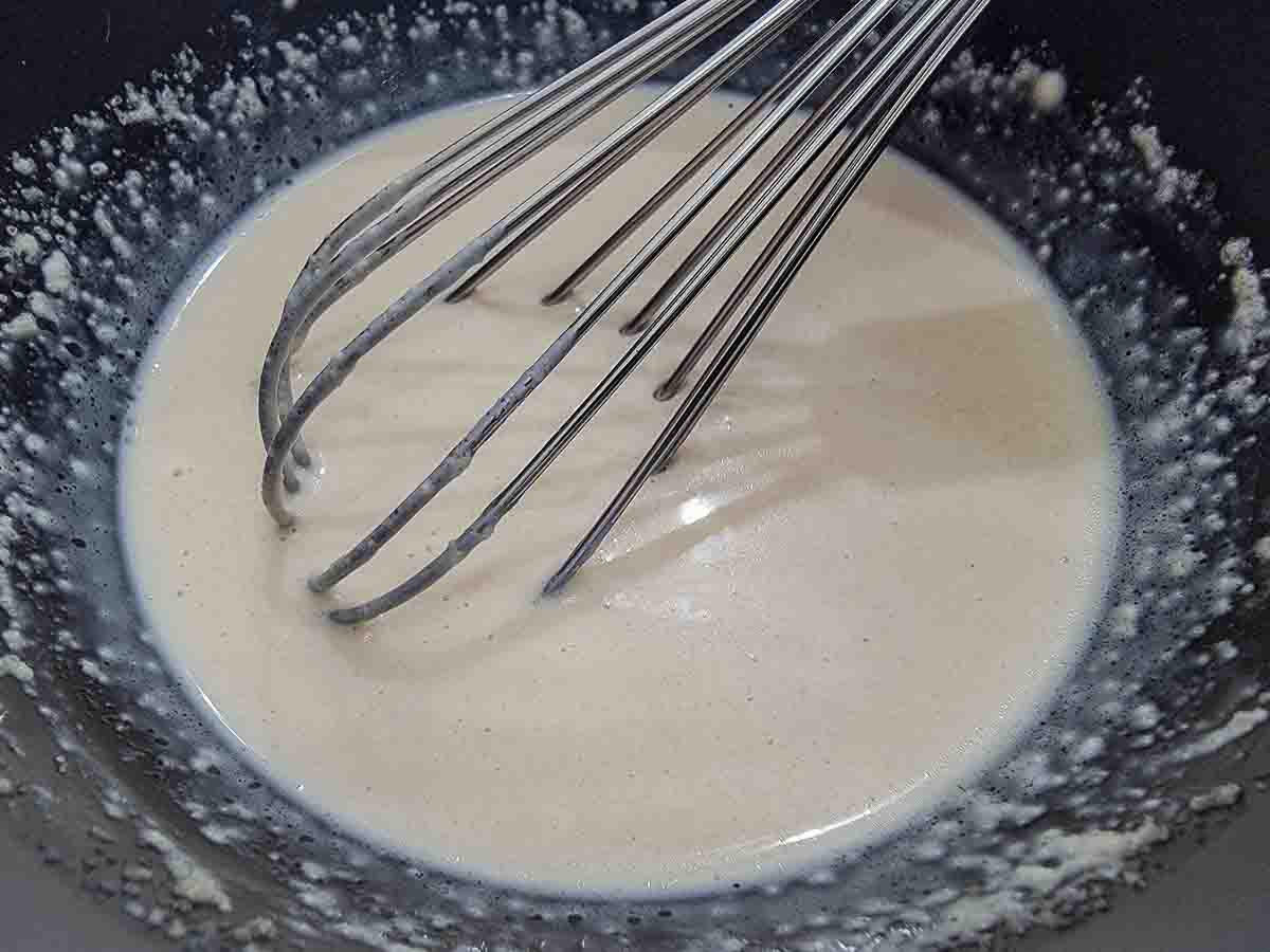 mayo and Dijon vinaigrette whisked in a bowl.