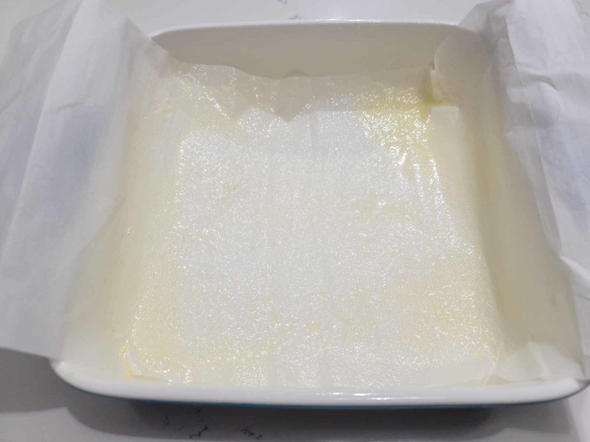 a parchment paper sling sprayed with non-stick spray in an 8x8 inch casserole dish.