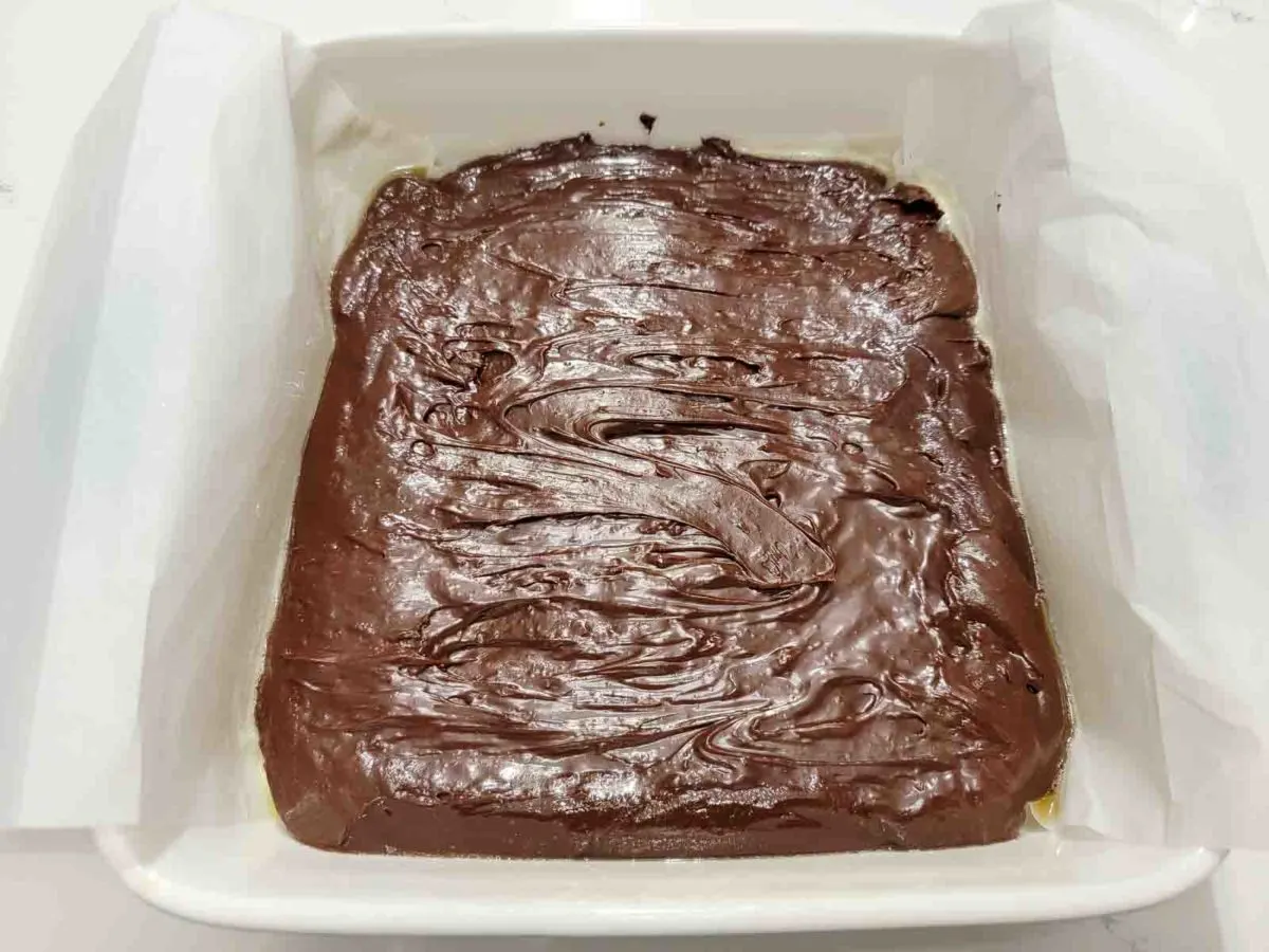 chocolate fudge spread in an 8x8 inch baking dish.