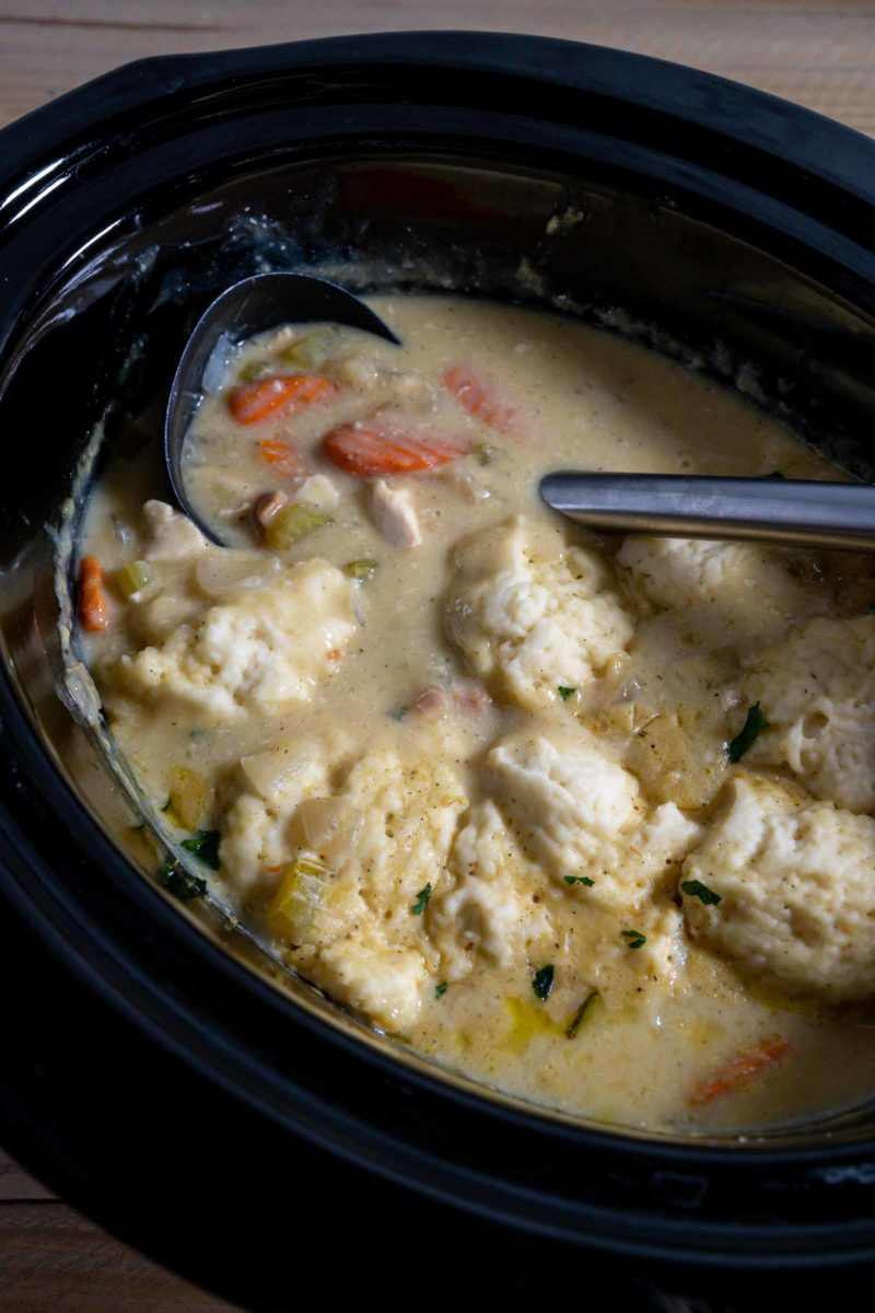 Crock Pot Dumplings and chicken stew in a slow cooker.