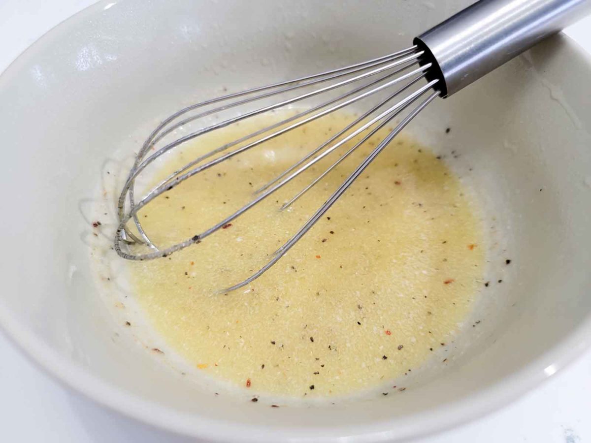 melted butter and zesty italian dressing mix whisked together in a bowl.