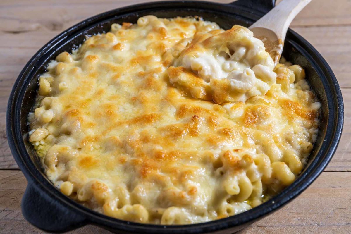 White Cheddar Mac and Cheese Baked in a cast iron skillet.