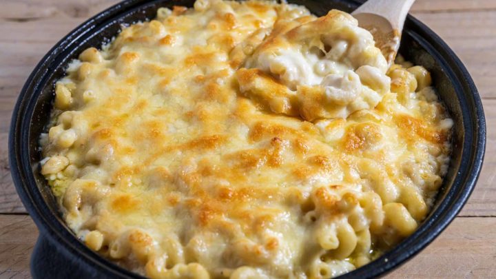 White Cheddar Mac and Cheese Baked in a cast iron skillet.
