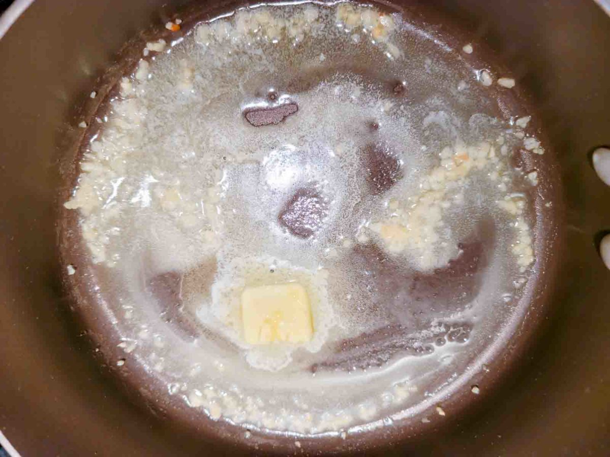 butter and garlic cooking in a pan.