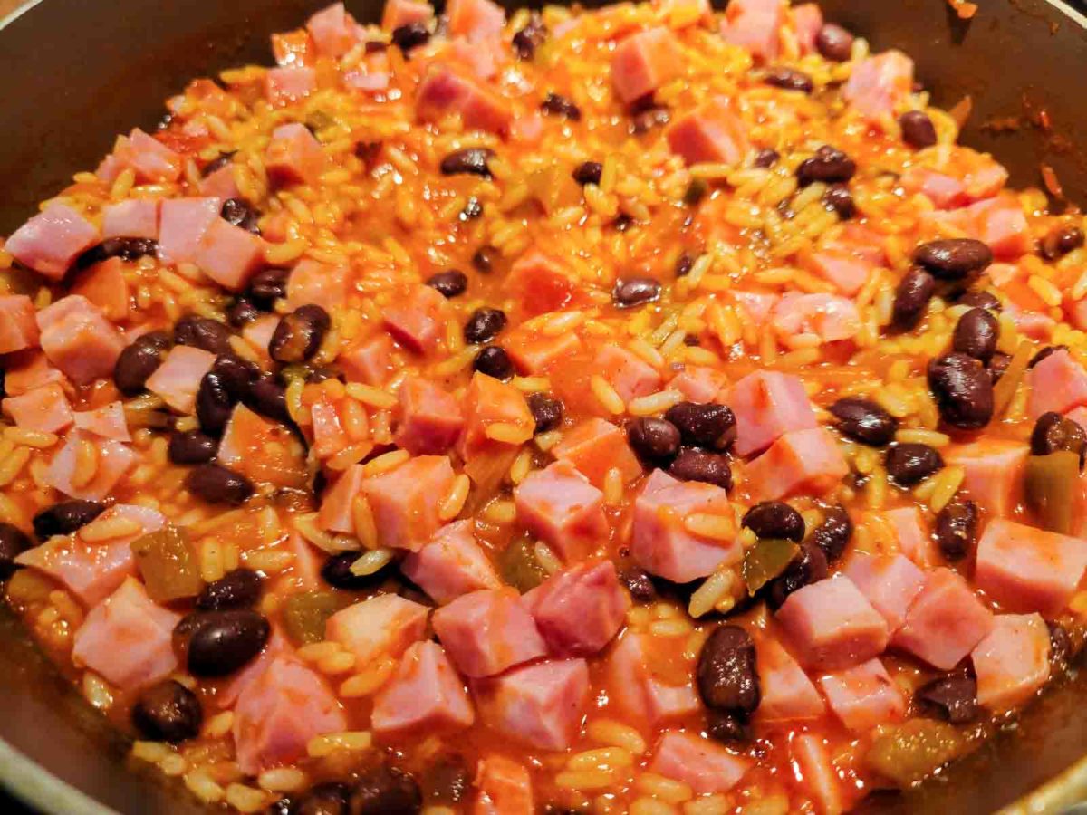 Mexican ham casserole filling cooking in a sauce pan.