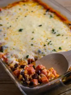 Mexican Rice Casserole with a spoon lifting some out.