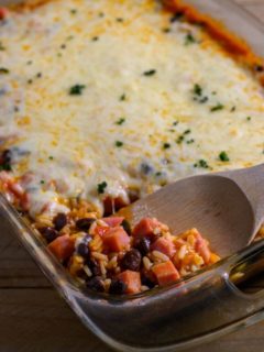 Mexican Rice Casserole with a spoon lifting some out.