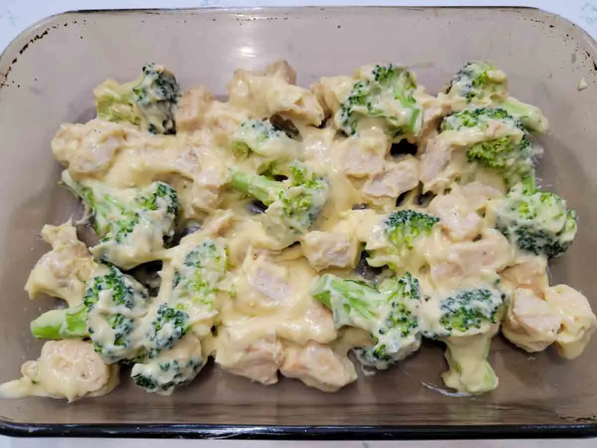 creamy chicken broccoli mixture in a baking dish.