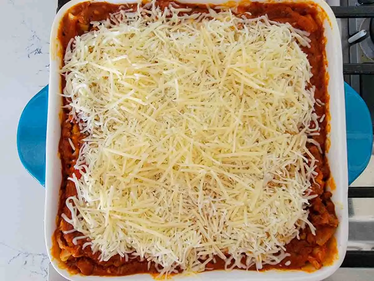 Ronzoni lasagna topped with mozzarella and Parmesan cheese.