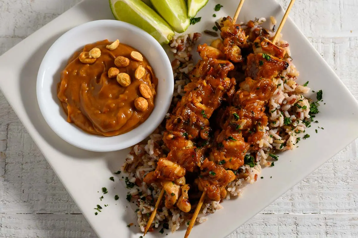 Thai Chicken Skewers with Peanut Sauce over rice.