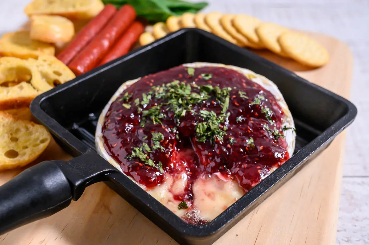 15-minute Baked Brie with Jam in a small baking dish.