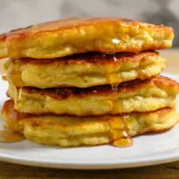 Banana Pancakes stacked on a plate.