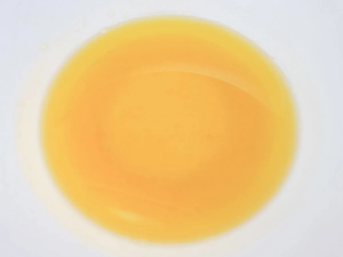 honey and olive oil mixed in a bowl.