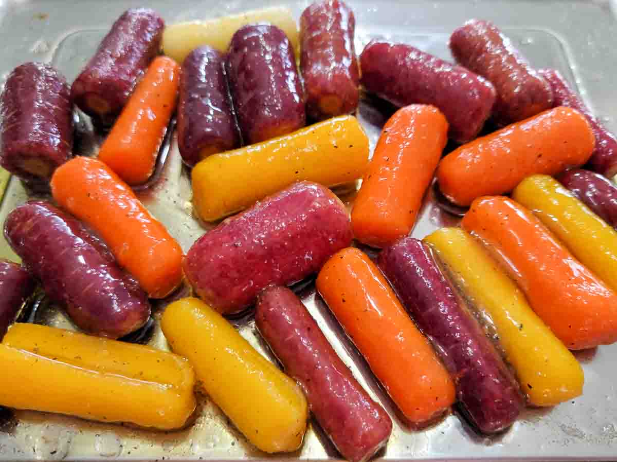 Glazed Rainbow Carrots in a baking sheet.
