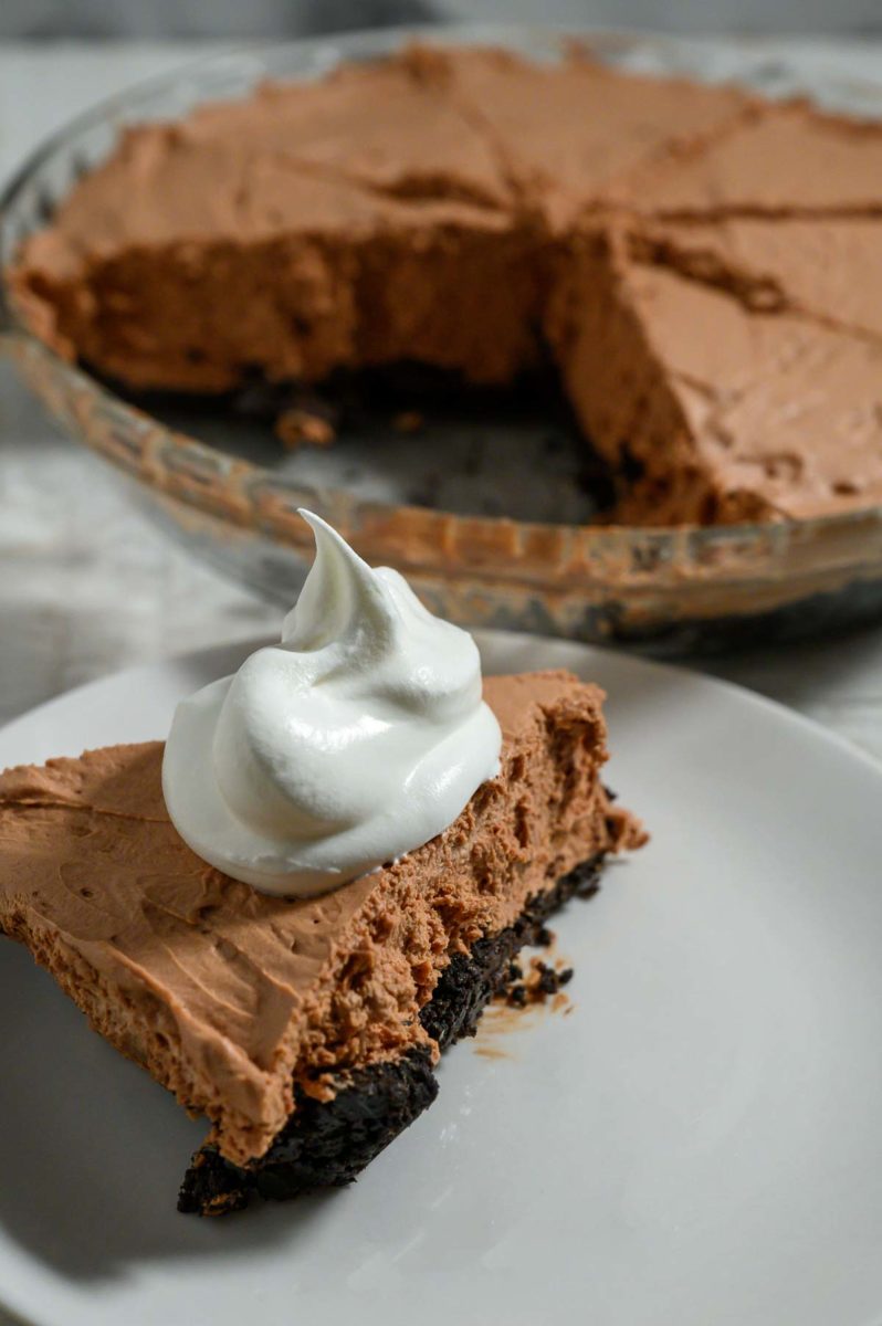 No Bake Chocolate Mousse Cheesecake on a plate and in a pie pan.