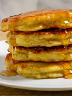 Banana Pancakes stacked on a plate.