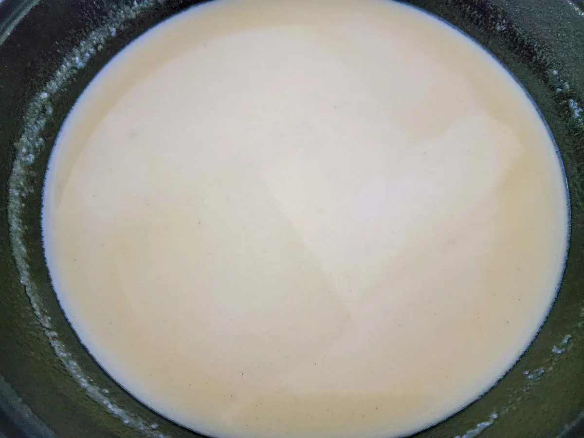chicken broth and milked whisked into butter and flour mixture in a skillet.