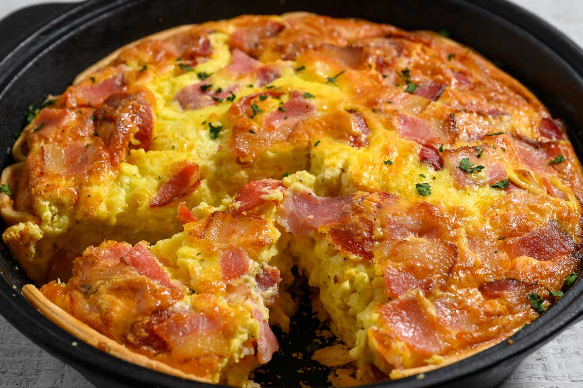 Easy Bacon Pepperoni Quiche in a cast iron skillet.
