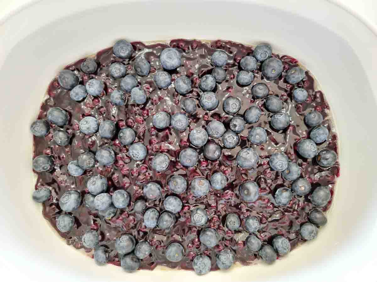 fresh blueberries and pie filling in a large dish.
